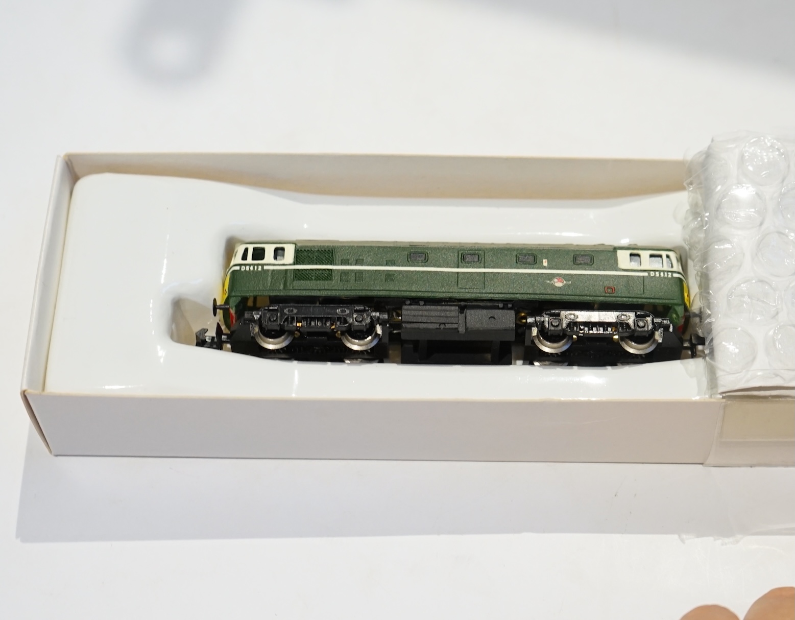 Two boxed Silver Fox Models N gauge BR Bo-Bo diesel locomotives; a Class 24 in dark blue livery, 24 067, and a Class 27 in dark green livery, D5412. Condition - good.